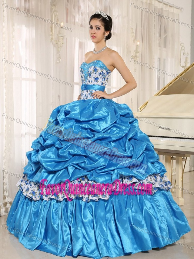 Beaded Blue Quinceanera Dress with Ruffled Layers in vogue in Taffeta and Printing