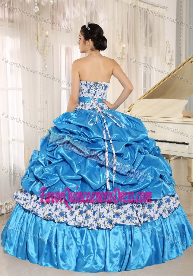 Beaded Blue Quinceanera Dress with Ruffled Layers in vogue in Taffeta and Printing