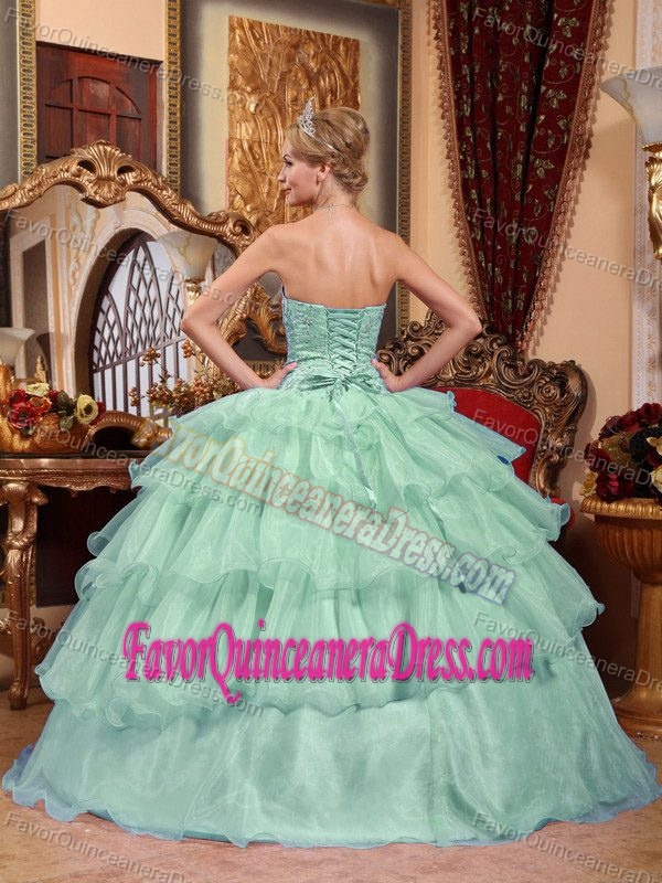 Elegant Light Green Organza Quinceanera Gown with Appliques and Ruffles