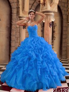 Beautiful Beaded and Ruched Quinceanera Dress with Ruffles in Blue Color